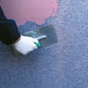 Штукатурка цегляних стін всередині будинку