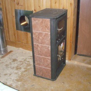 Як виготовити піч буржуйку для гаража з цегли і металу?