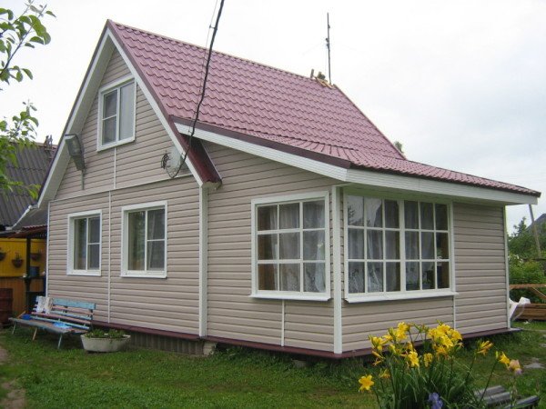 Особливості обробки деревяного будинку зовні