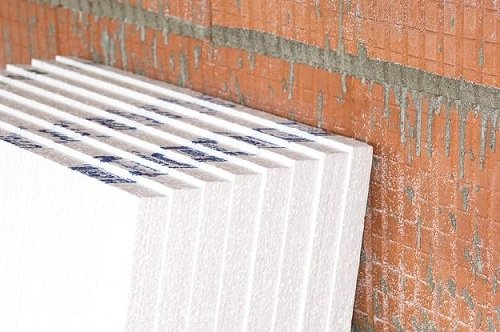 Утеплювач для стін зовні: вибір матеріалу. Установка схилом і направляючої. Нанесення клею і кріплення до стіни. Обробка стиків і місць кріплення