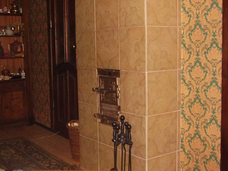 Облицювання печі і каміна керамічною плиткою своїми руками: вибір і властивості плитки, етапи робіт, фото і відео