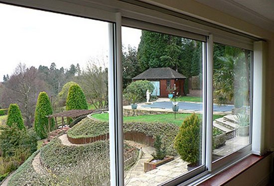 Розсувні балконні рами з пвх, алюмінію, дерева