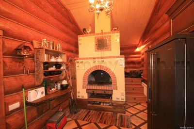 Способи оздоблення печі в приватному будинку: плиткою, декоративним каменем, склошпалерами