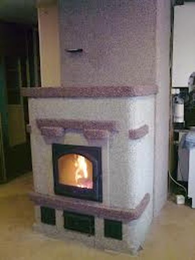 Способи оздоблення печі в приватному будинку: плиткою, декоративним каменем, склошпалерами