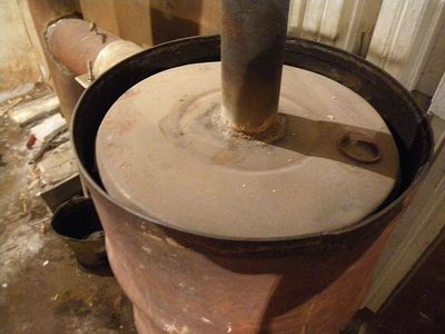 Піч тривалого горіння на тирсі: монтаж своїми руками