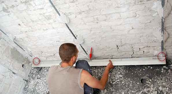 Штукатурка стін по маяках: способи кріплення