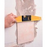 Як клеїти плитку на стіну правильно