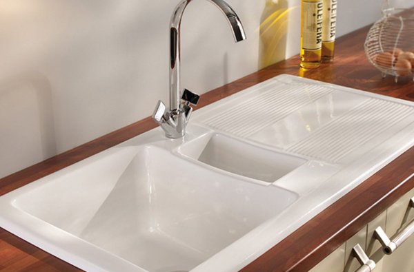 Подвійна мийка для кухні: вибір раковини з двома чашами і технологія підключення